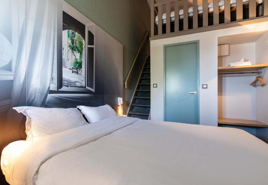 Postel nebo postele na pokoji v ubytování B&B HOTEL Valence Nord