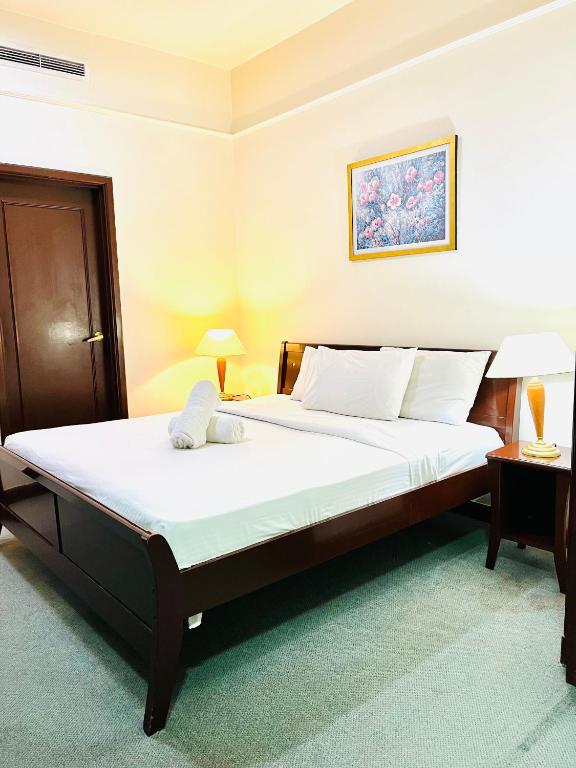 Postel nebo postele na pokoji v ubytování RESORT SUITES AT BARJAYA TIMES SQUARE kL