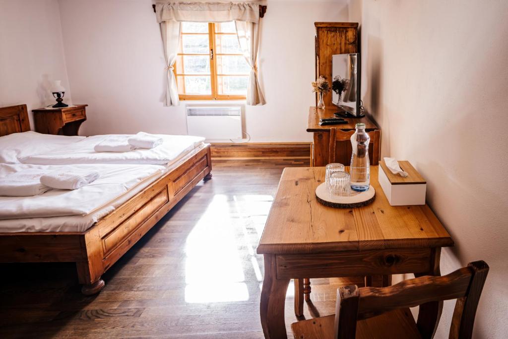 Postel nebo postele na pokoji v ubytování Mlýn Kozlovice