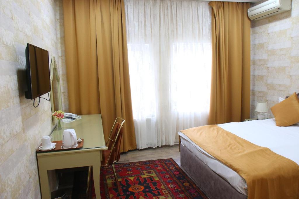 Postel nebo postele na pokoji v ubytování Boutique Nar Baku