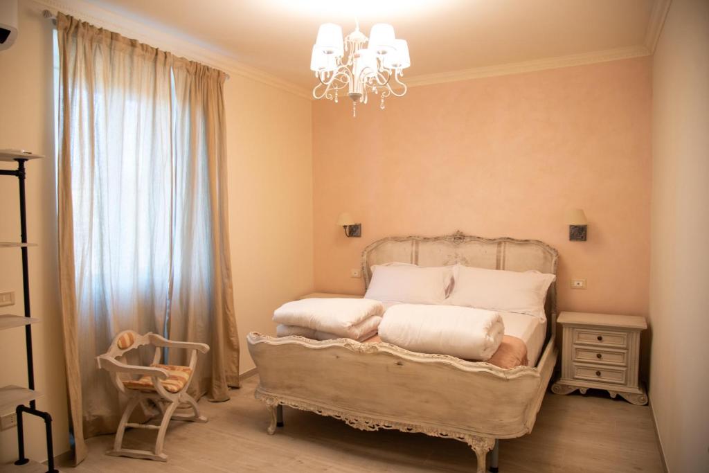 Postel nebo postele na pokoji v ubytování Grazia e Gino Suite