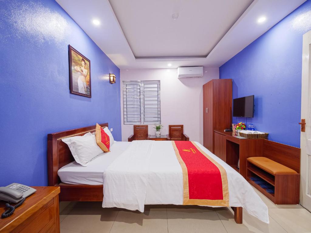 Postel nebo postele na pokoji v ubytování New An Phú Hotel