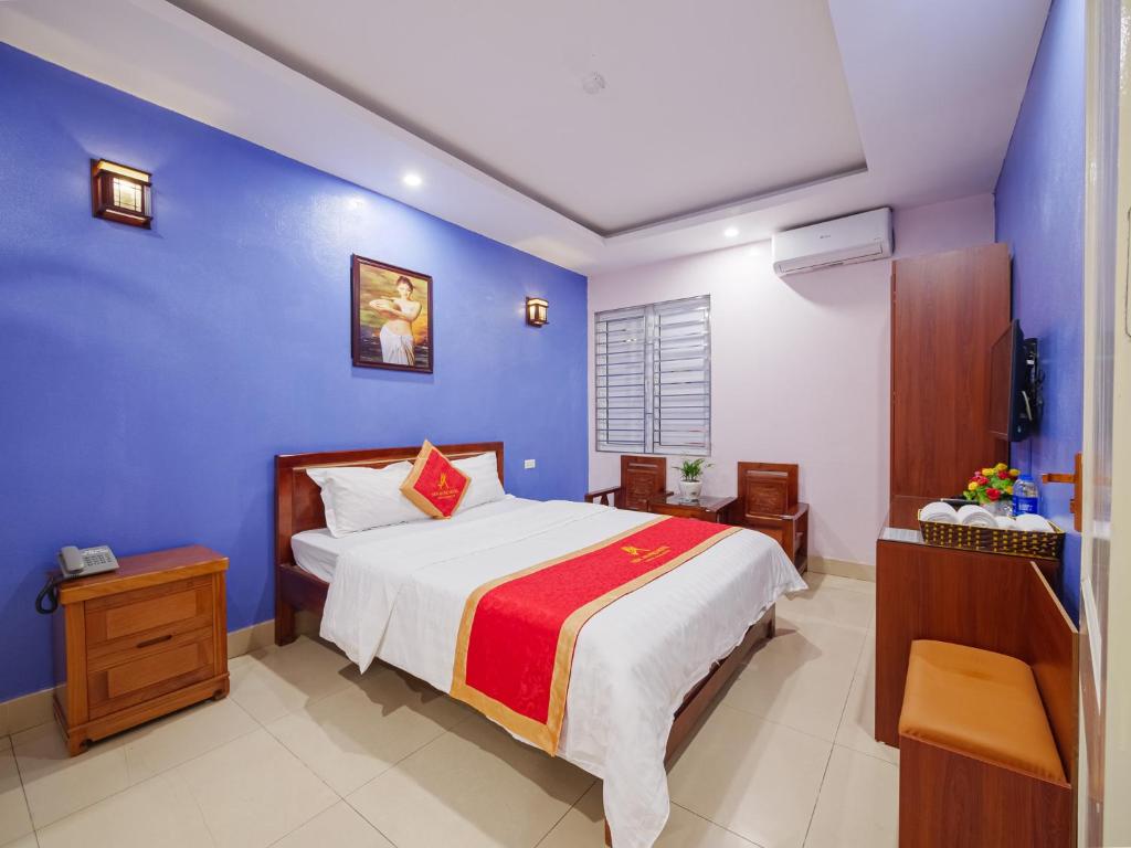 Postel nebo postele na pokoji v ubytování New An Phú Hotel