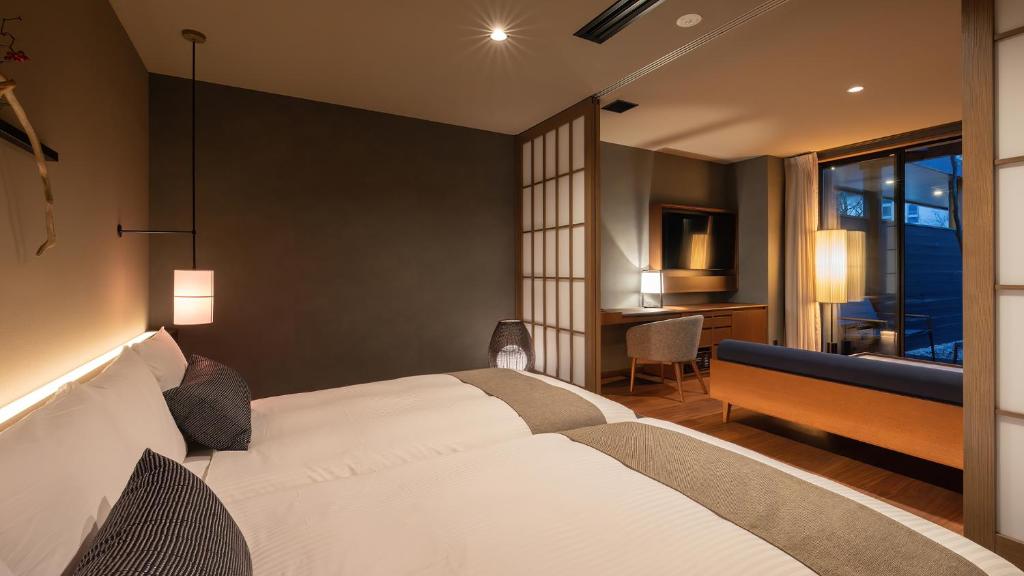 Postel nebo postele na pokoji v ubytování Nasu-Onsen Shinshun no Kago Hewitt Resort