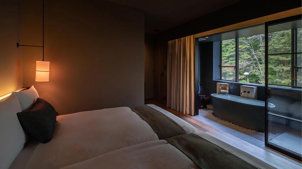 Postel nebo postele na pokoji v ubytování Nasu-Onsen Shinshun no Kago Hewitt Resort