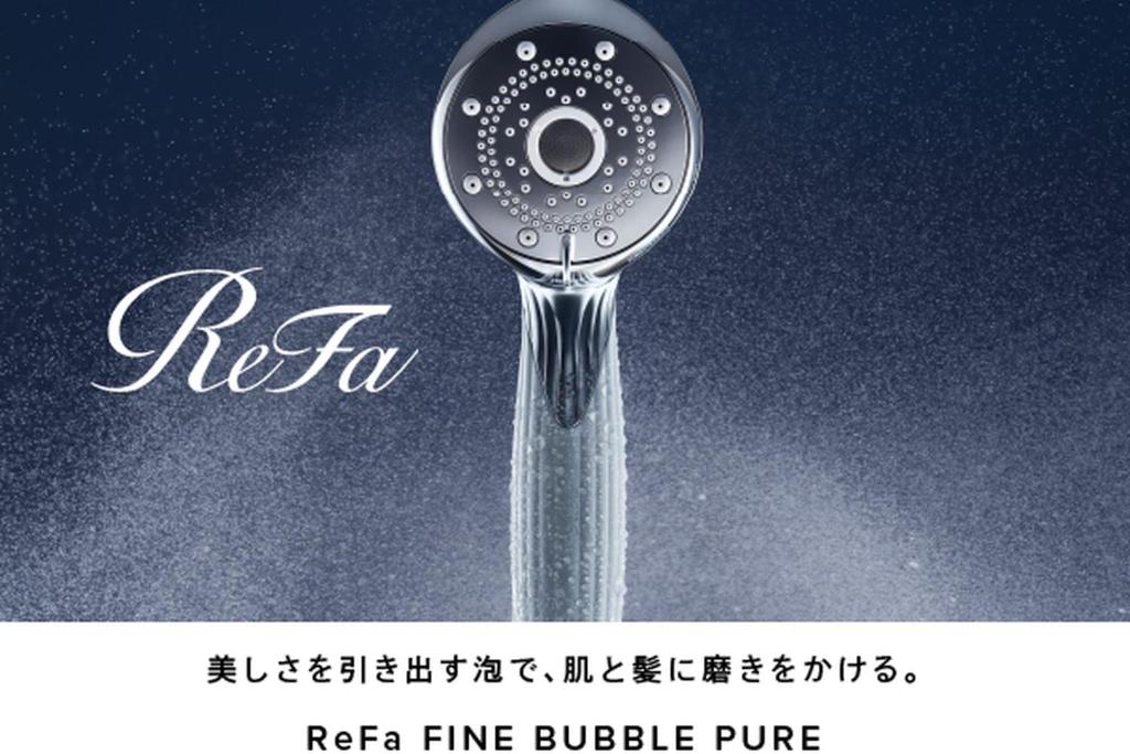 a shower head with water coming out of it at HOTEL MYSTAYS PREMIER Kanazawa in Kanazawa