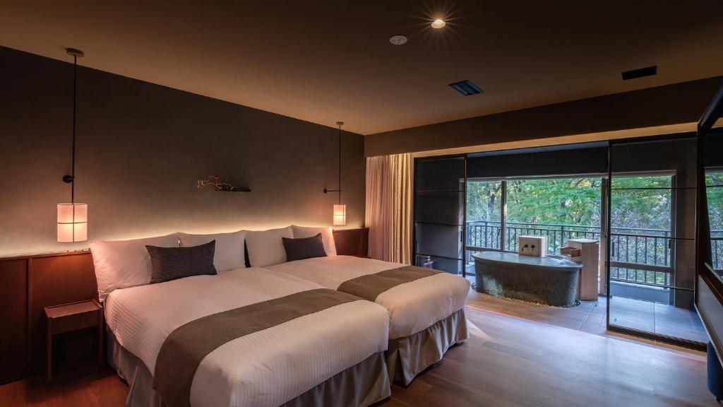 Postel nebo postele na pokoji v ubytování Nasu-Onsen Shinshun no Kago Hewitt Resort