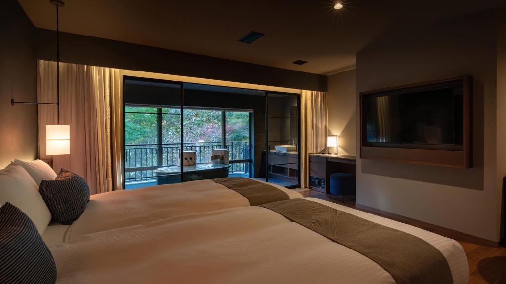 Postel nebo postele na pokoji v ubytování Nasu-Onsen Shinshun no Kago Hewitt Resort