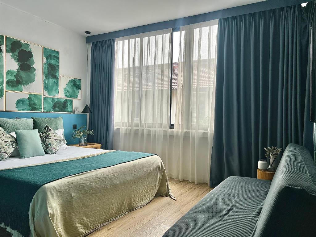 a bedroom with a large bed and a window at Shanghai Guiwu Village Near Disney Resort in Shanghai