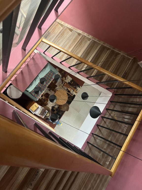an overhead view of a kitchen with a staircase at Shanghai Guiwu Village Near Disney Resort in Shanghai