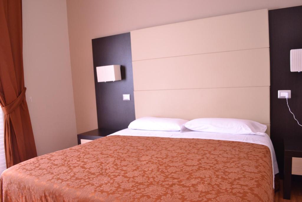 Posteľ alebo postele v izbe v ubytovaní Hotel Nautilus
