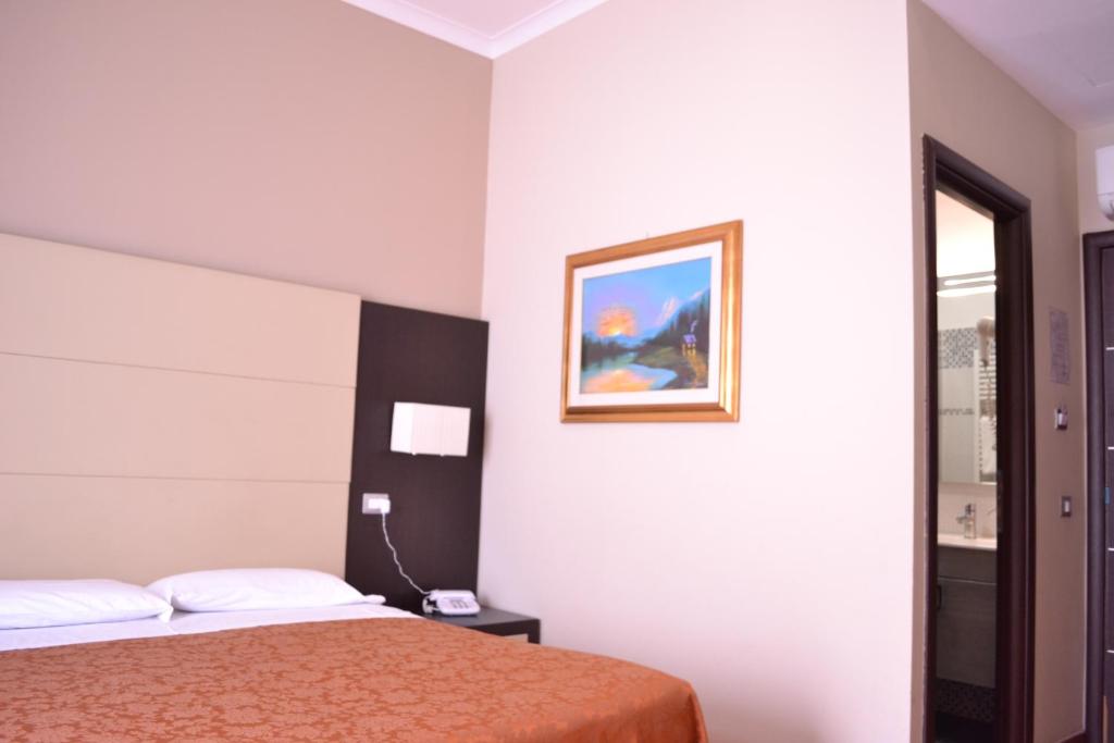 Posteľ alebo postele v izbe v ubytovaní Hotel Nautilus