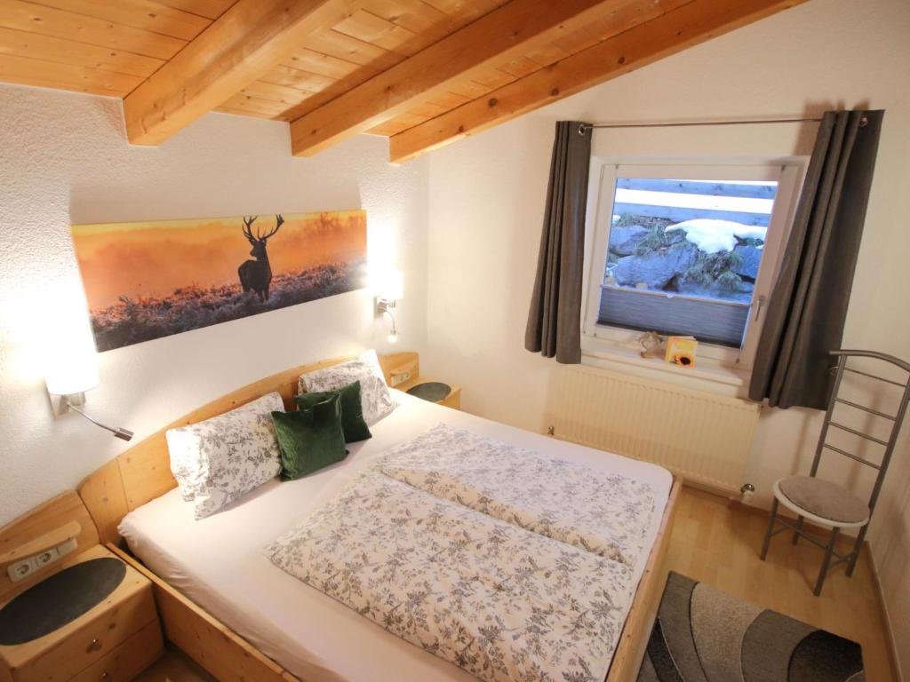 Postel nebo postele na pokoji v ubytování Apartment Piz Munschuns by Interhome