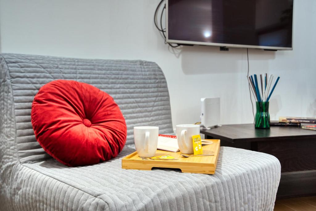 TV a/nebo společenská místnost v ubytování CaseOspitali - Casa Andrea, accoglienza in corte storica per 3 persone