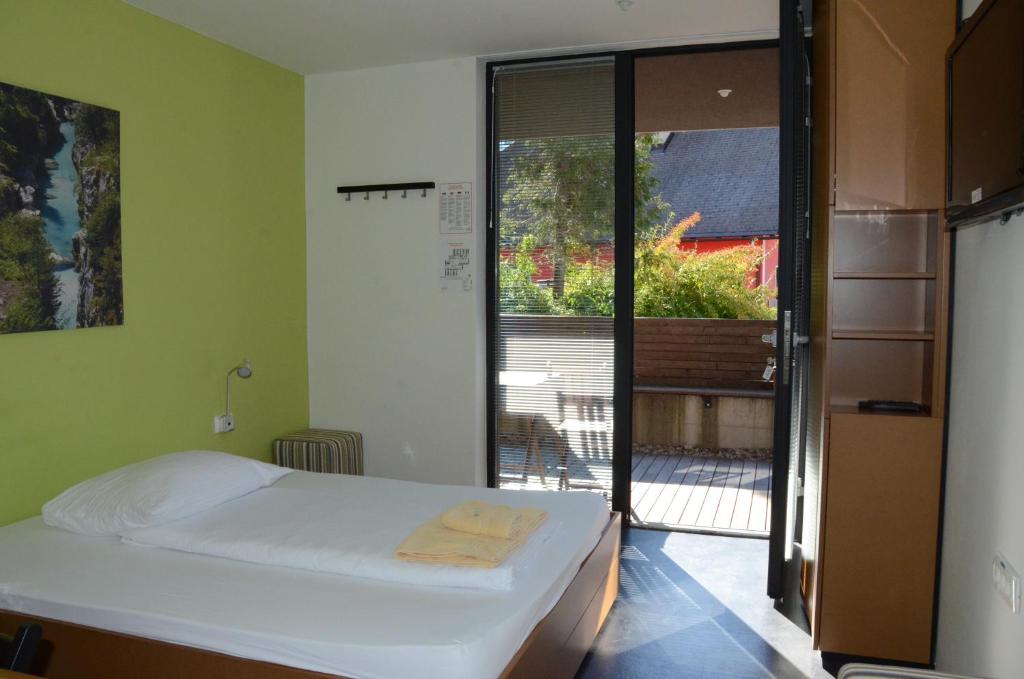 Postel nebo postele na pokoji v ubytování Hotel Sanje ob Soči ***/****