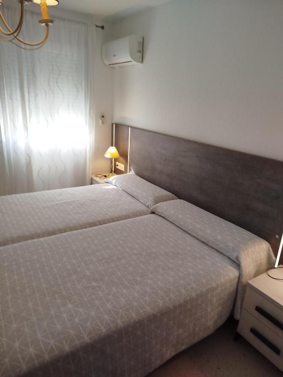 Postel nebo postele na pokoji v ubytování Apartamento centrico