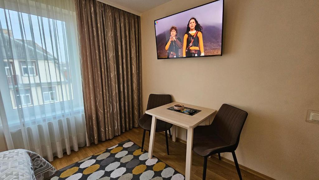TV a/nebo společenská místnost v ubytování Nileja