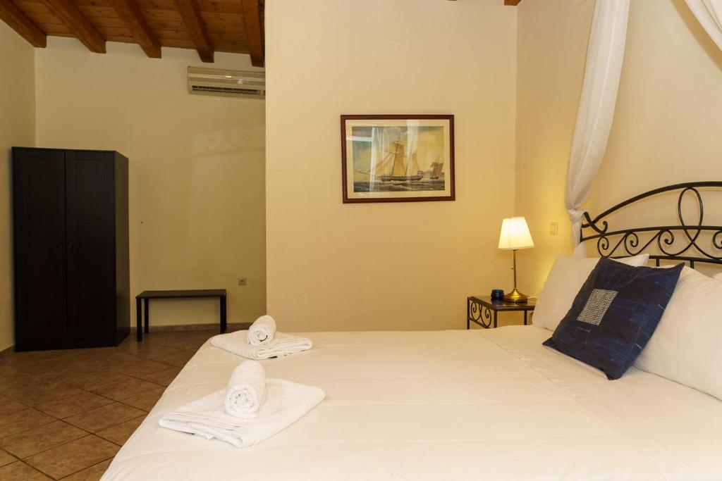 Postel nebo postele na pokoji v ubytování Nereids Guesthouse