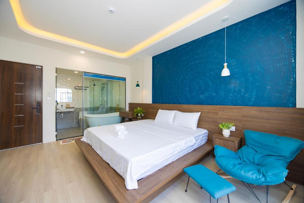 Postel nebo postele na pokoji v ubytování Tiamo Hotel
