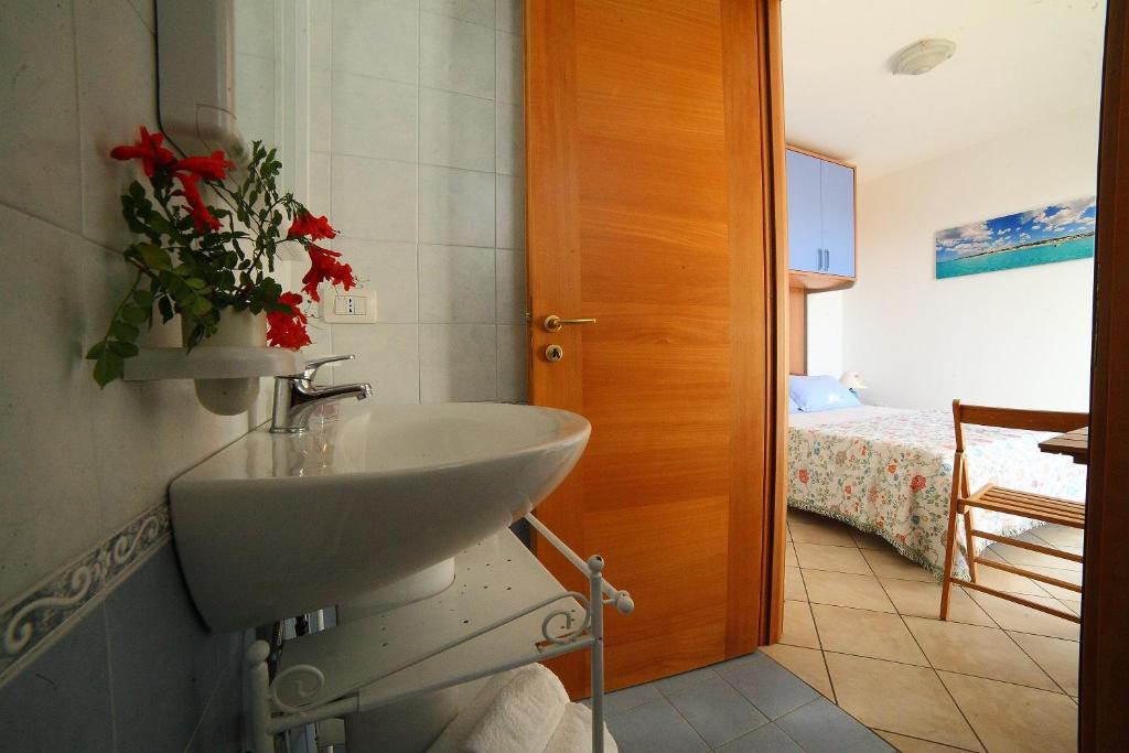 Postel nebo postele na pokoji v ubytování Case vacanza Torre Mozza Ugento Afr0dite