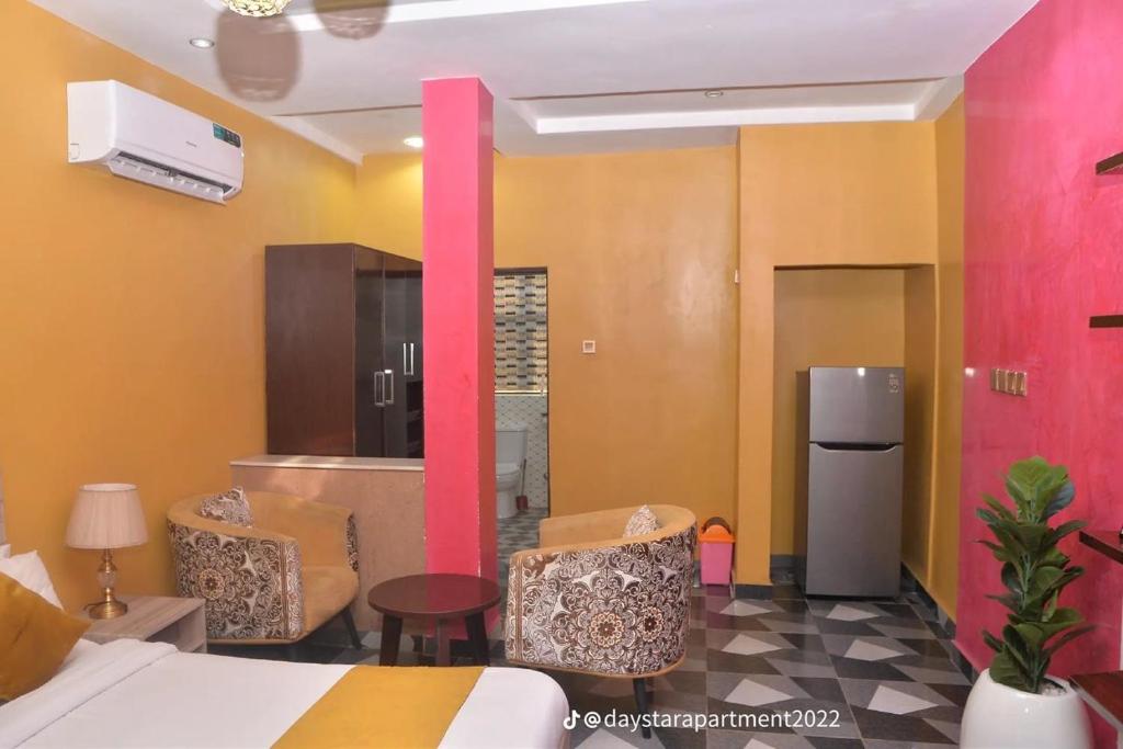 Postel nebo postele na pokoji v ubytování De-Lites Hotel
