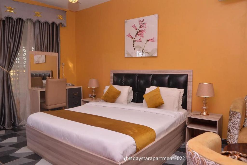 Postel nebo postele na pokoji v ubytování De-Lites Hotel