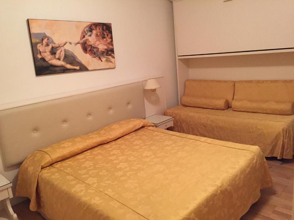 Postel nebo postele na pokoji v ubytování Albergo ai Tolentini