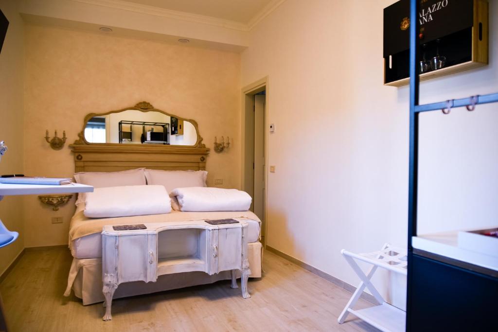 Postel nebo postele na pokoji v ubytování Grazia e Gino Suite