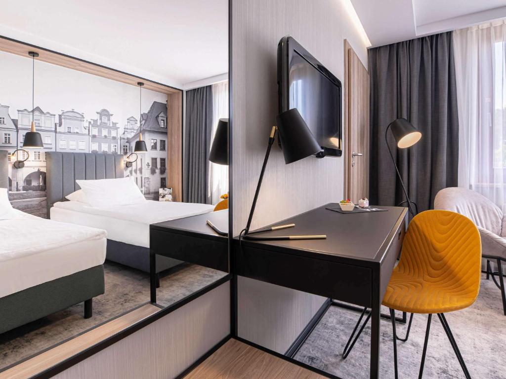 Posteľ alebo postele v izbe v ubytovaní Mercure Jelenia Góra