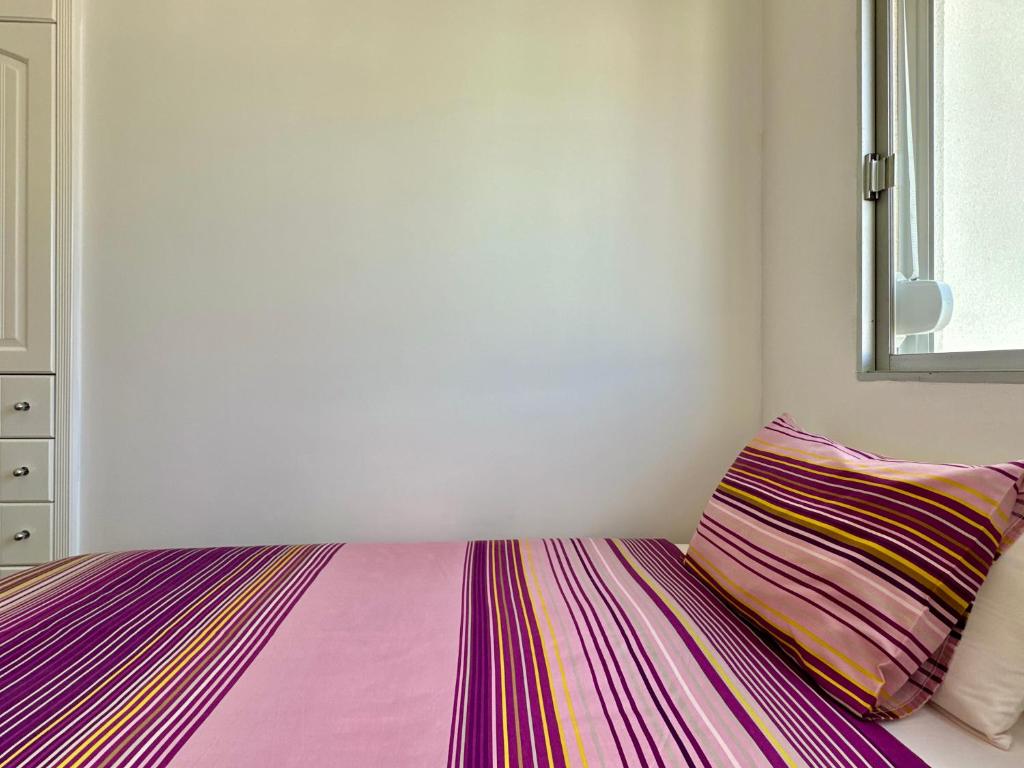 Postel nebo postele na pokoji v ubytování HostiGuest CoLiving León y Castillo