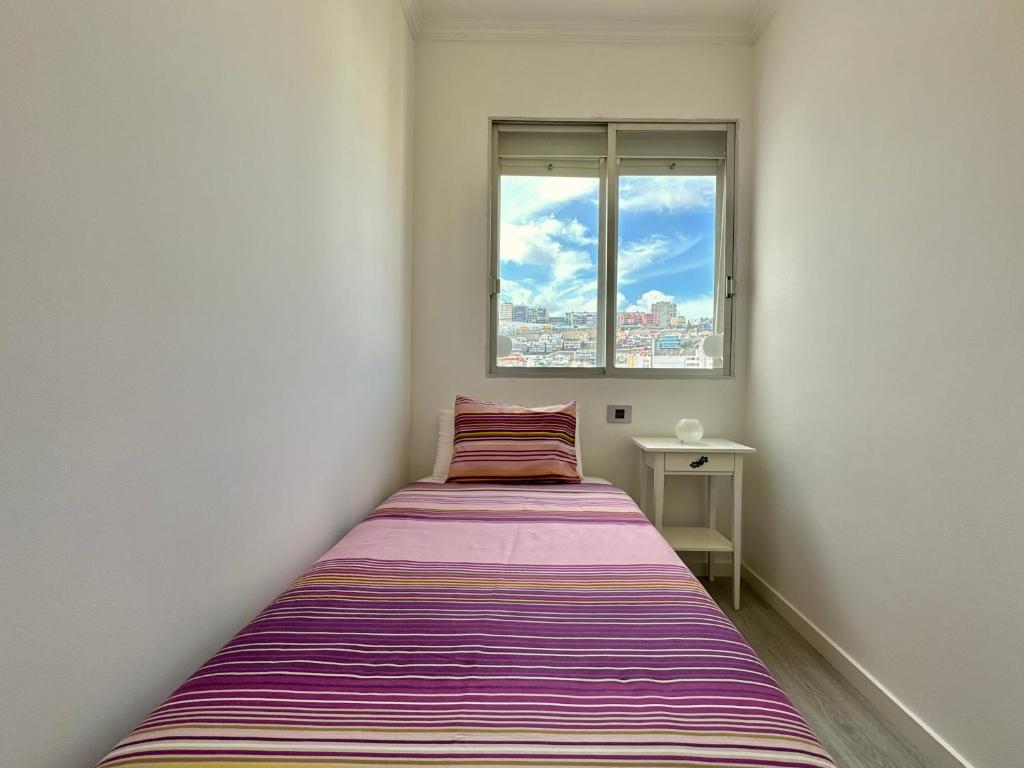 Postel nebo postele na pokoji v ubytování HostiGuest CoLiving León y Castillo