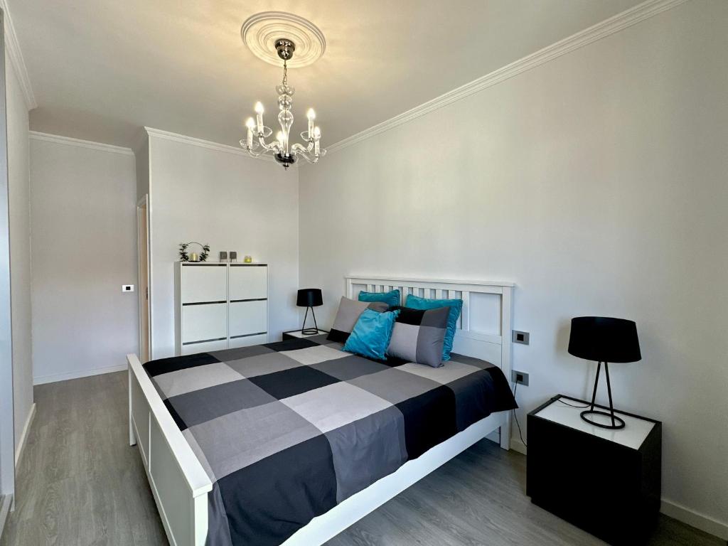 Postel nebo postele na pokoji v ubytování HostiGuest CoLiving León y Castillo