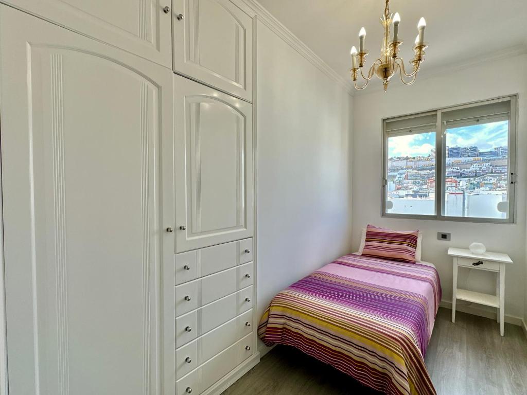 Postel nebo postele na pokoji v ubytování HostiGuest CoLiving León y Castillo