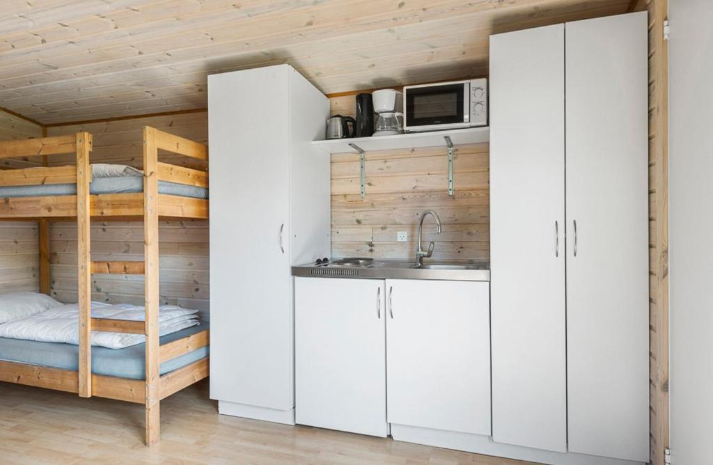 Kuchyň nebo kuchyňský kout v ubytování First Camp Ajstrup Strand