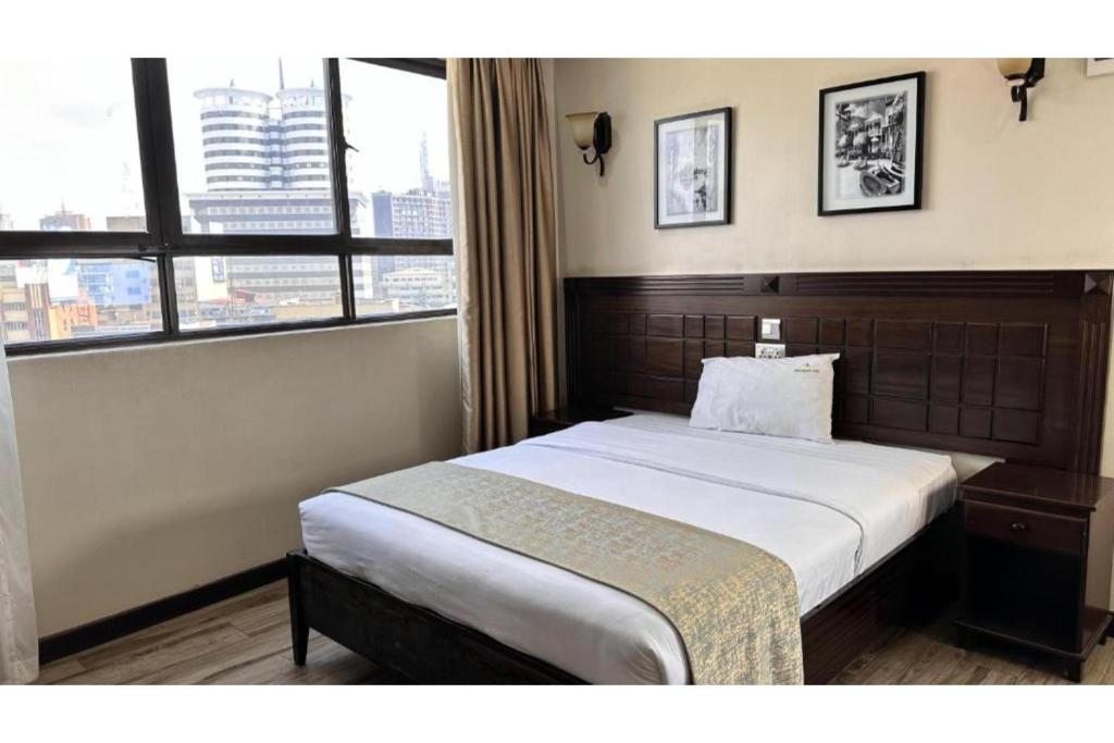 Postel nebo postele na pokoji v ubytování Hemak Suites Hotel