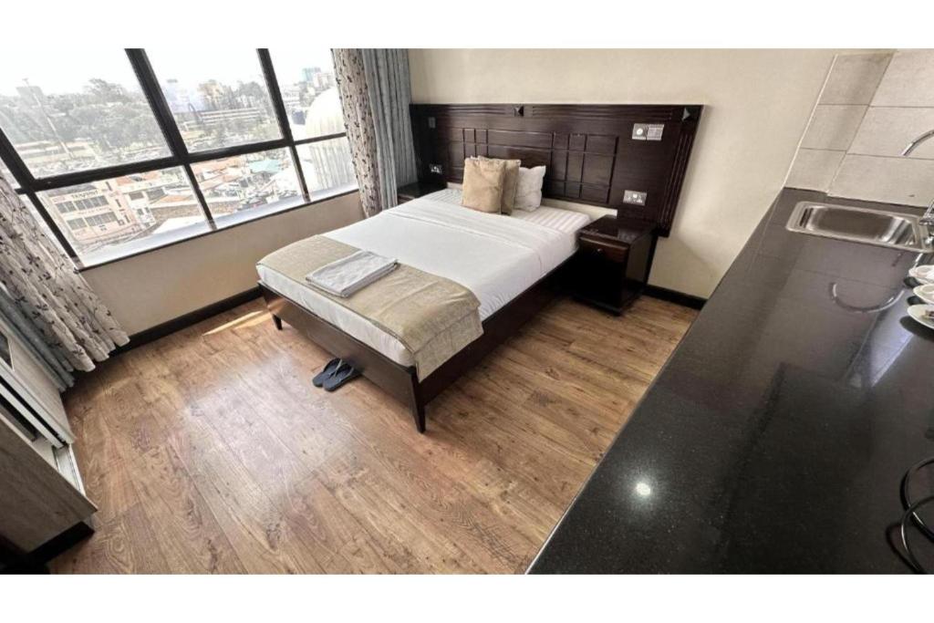 Postel nebo postele na pokoji v ubytování Hemak Suites Hotel