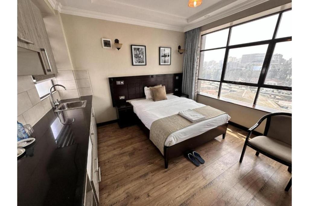 Postel nebo postele na pokoji v ubytování Hemak Suites Hotel