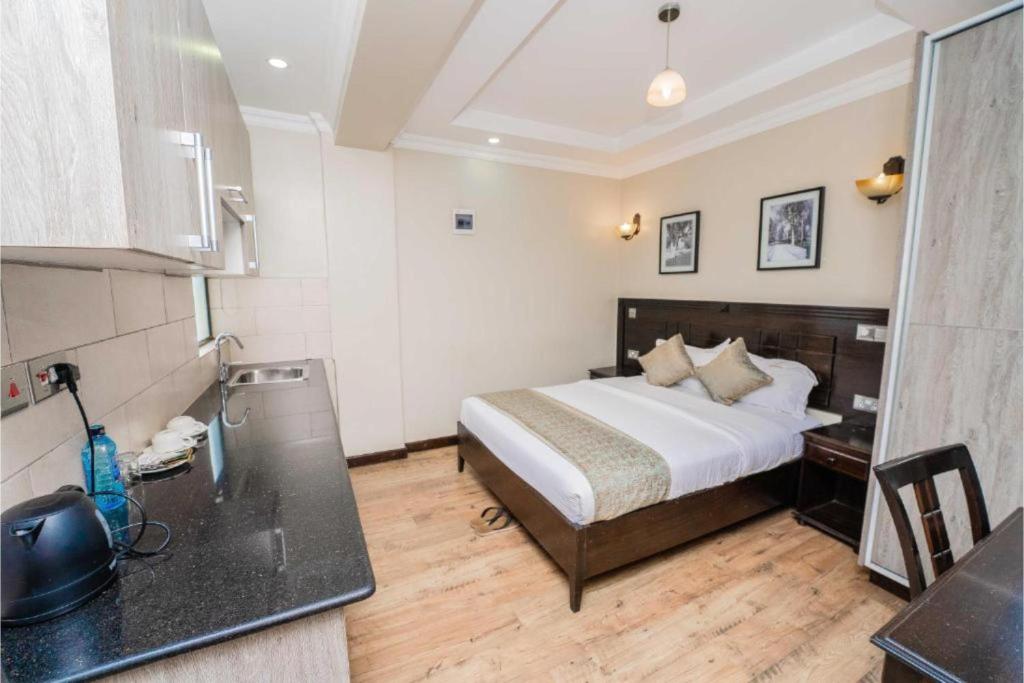 Postel nebo postele na pokoji v ubytování Hemak Suites Hotel