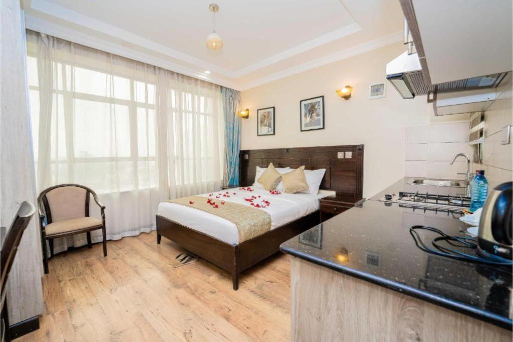 Postel nebo postele na pokoji v ubytování Hemak Suites Hotel