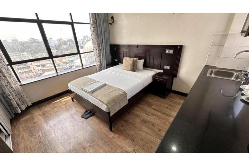 Postel nebo postele na pokoji v ubytování Hemak Suites Hotel