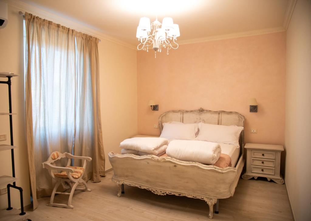 Postel nebo postele na pokoji v ubytování Grazia e Gino Suite