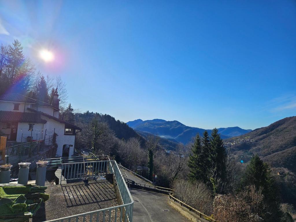 a view of a house with mountains in the background at La Casa Del Lupo in Serina