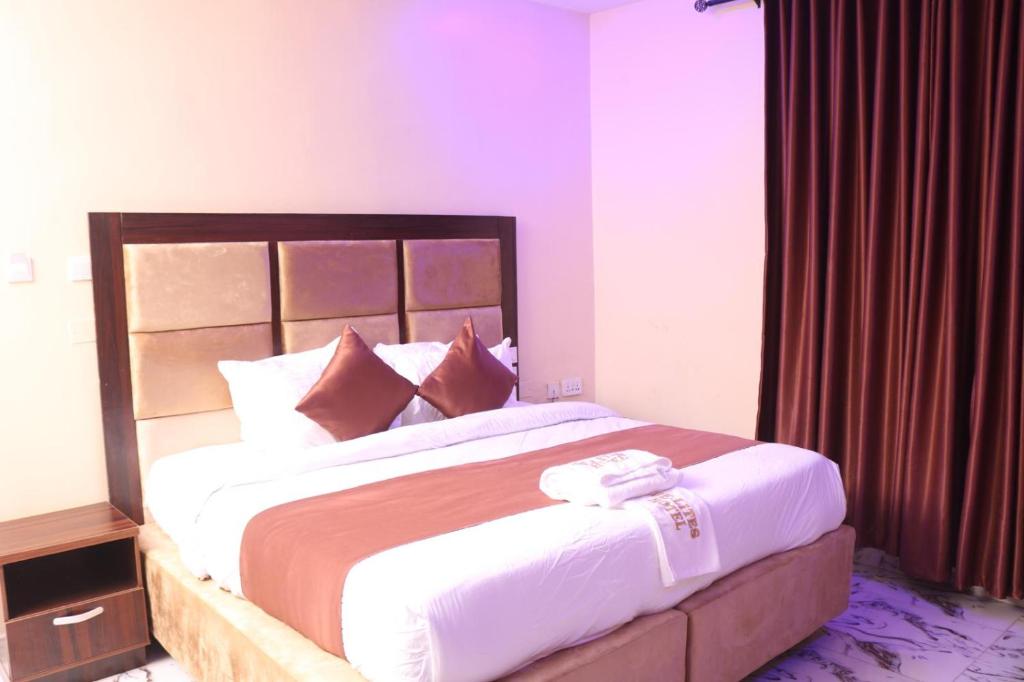 Postel nebo postele na pokoji v ubytování De-Lites Hotel