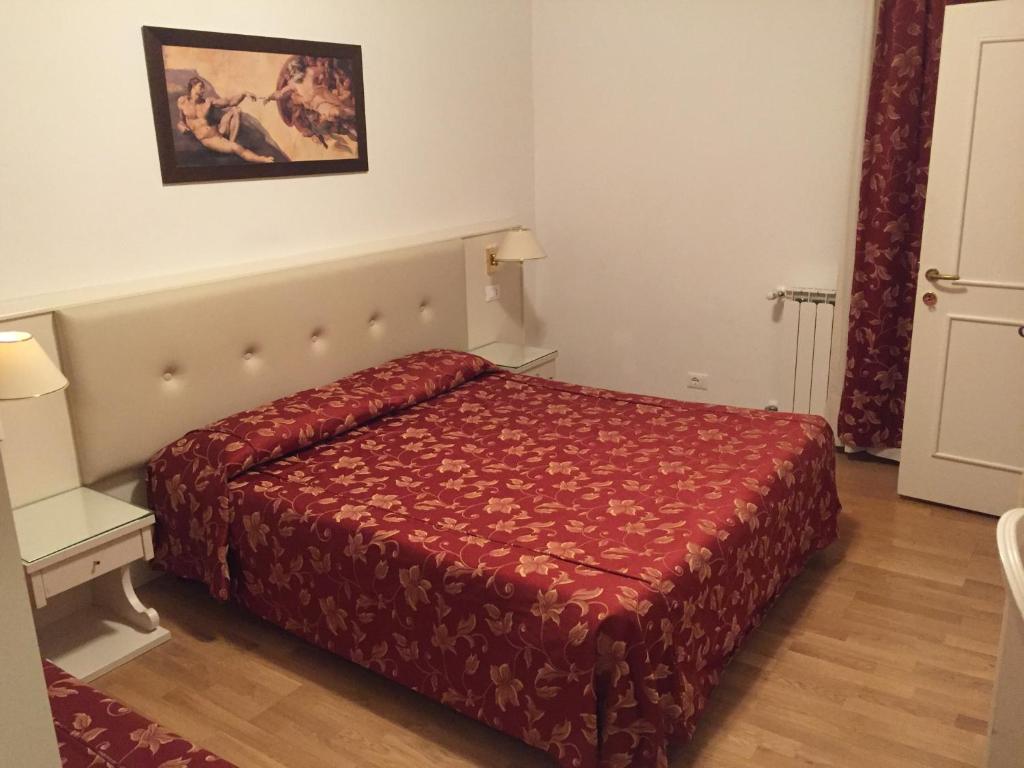 Postel nebo postele na pokoji v ubytování Albergo ai Tolentini