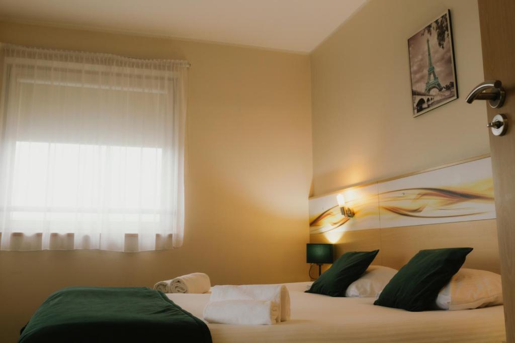 Postel nebo postele na pokoji v ubytování Quality Silesian Hotel