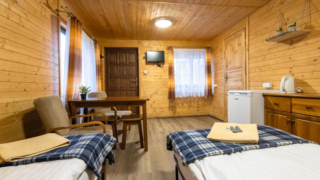 Postel nebo postele na pokoji v ubytování Ośrodek Wypoczynek Wodnik