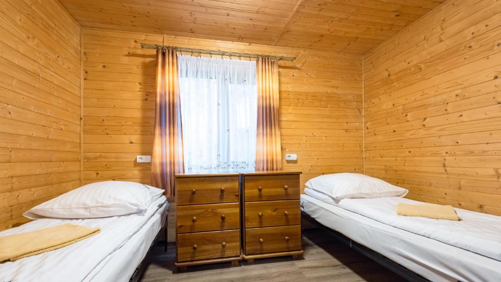 Postel nebo postele na pokoji v ubytování Ośrodek Wypoczynek Wodnik