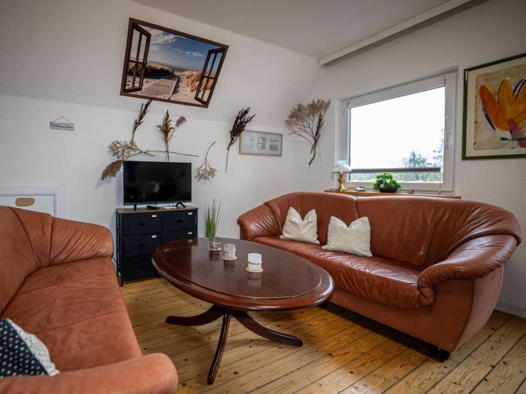 TV a/nebo společenská místnost v ubytování 194 Fewo Dat LütjeHuus mit Dachterrasse im ersten Stock