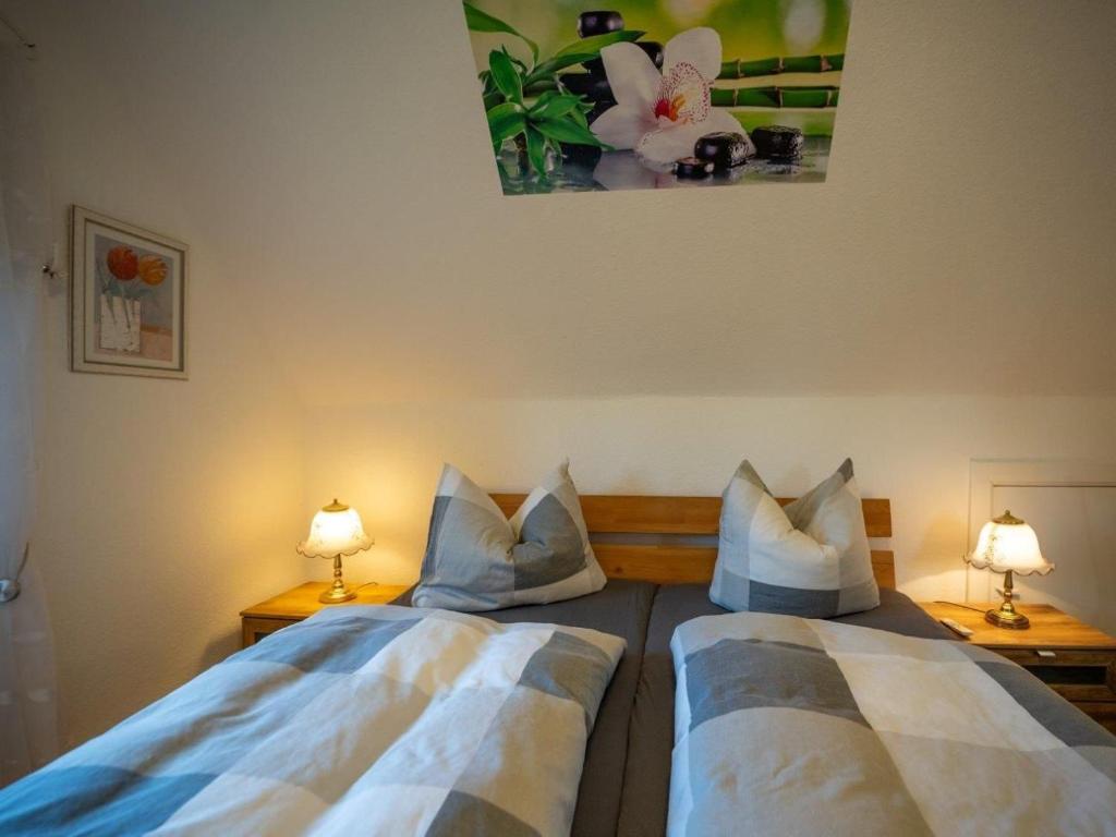 Postel nebo postele na pokoji v ubytování 194 Fewo Dat LütjeHuus mit Dachterrasse im ersten Stock