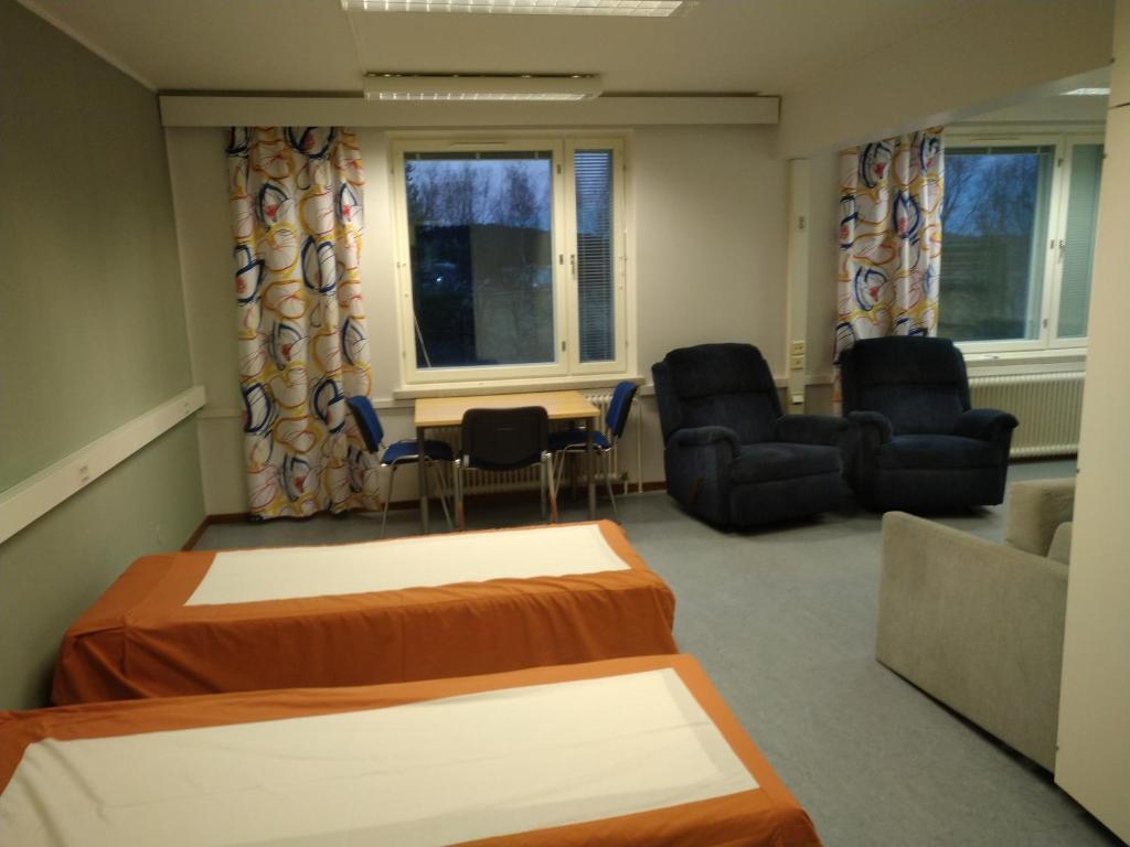 Postel nebo postele na pokoji v ubytování Grand Hostel Ivalo